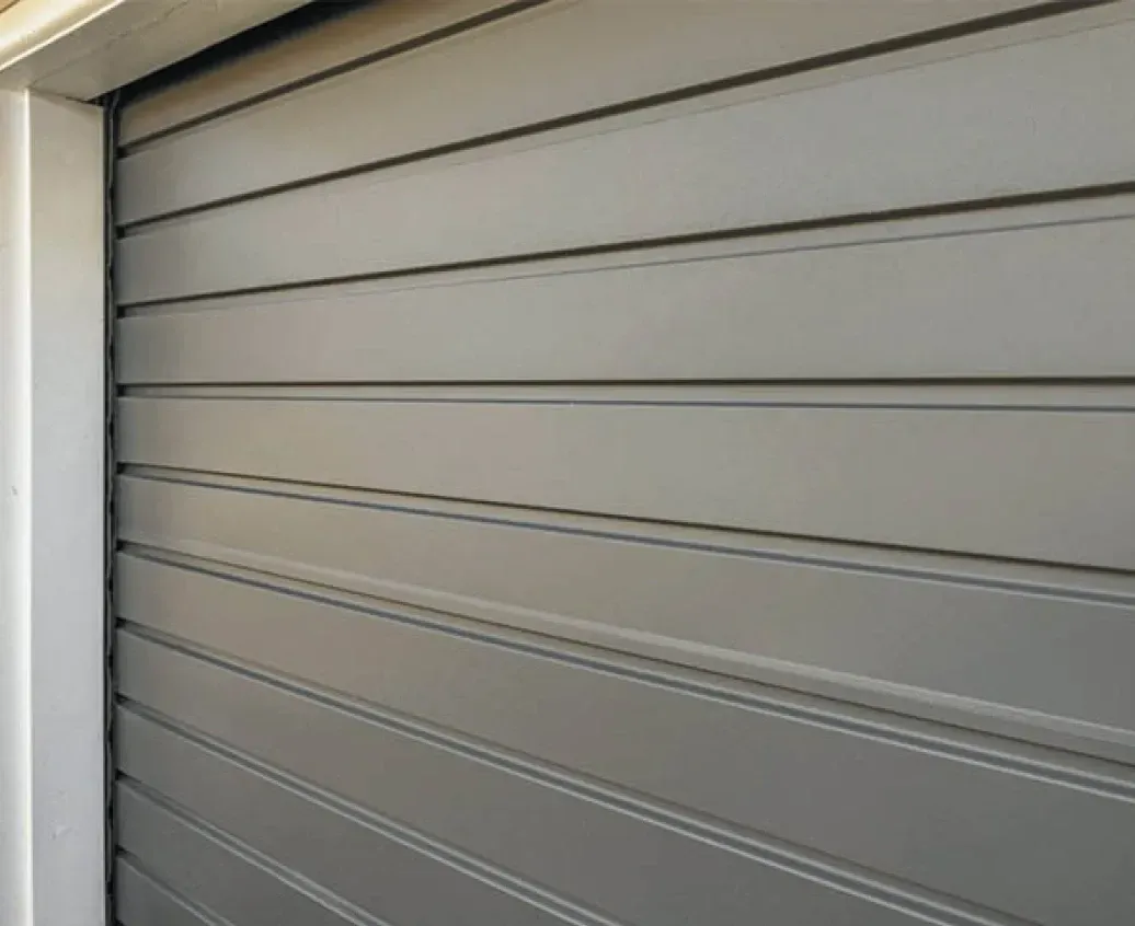 A Close Up of a Gray Garage Door on a Building — Hastings Garage Door Services in Port Macquarie