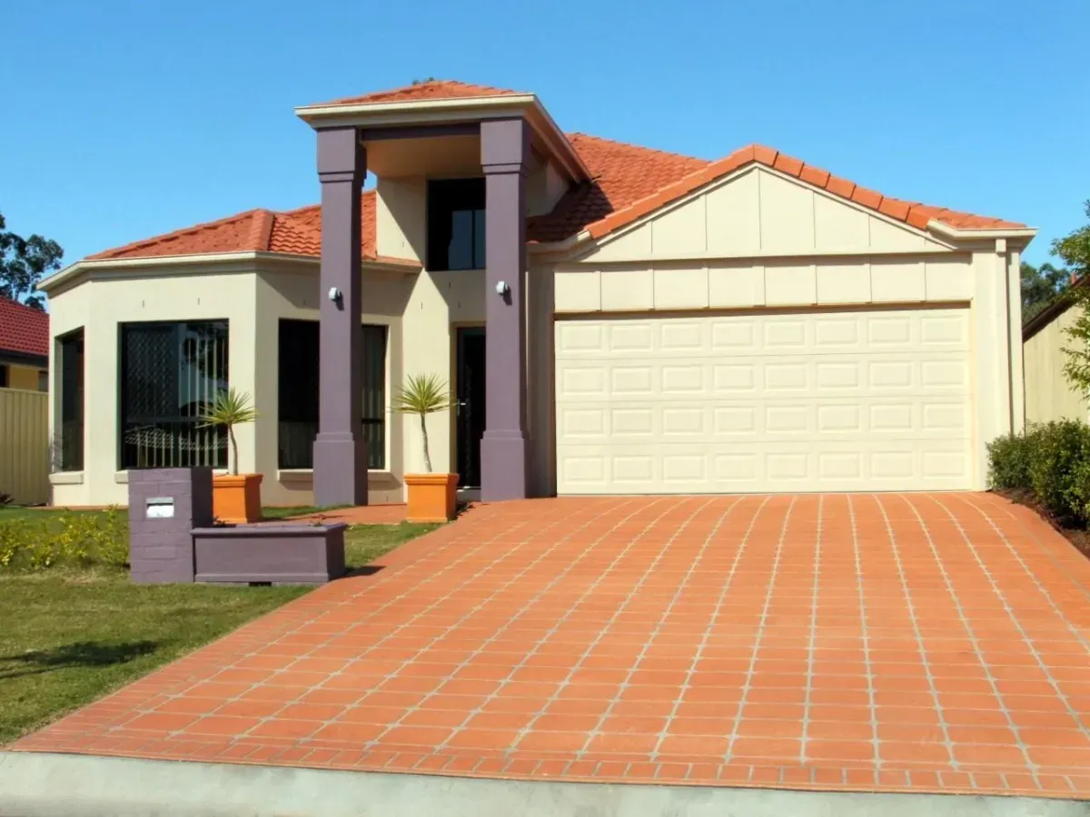 A Modern House with Garage Door and Driveway — Hastings Garage Door Services in Port Macquarie