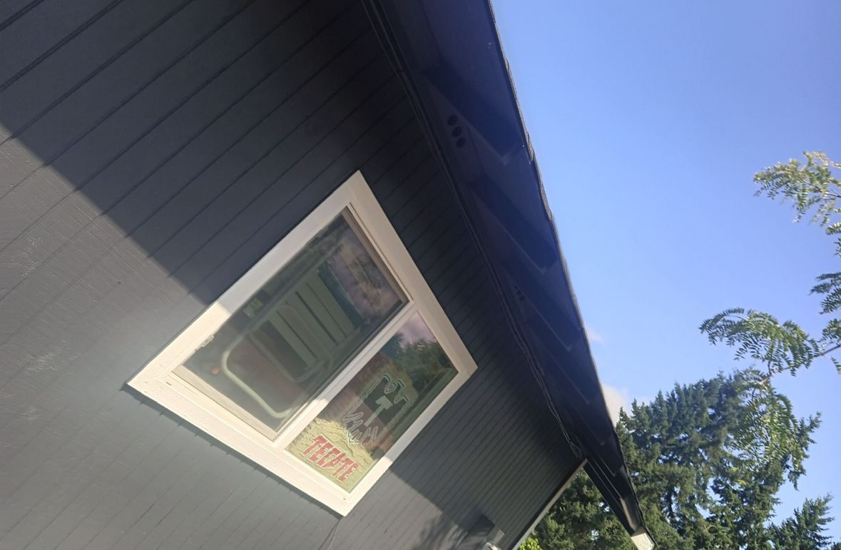 Window of Brown House — Lacey, WA — Seamless Gutters Troy Services LLC