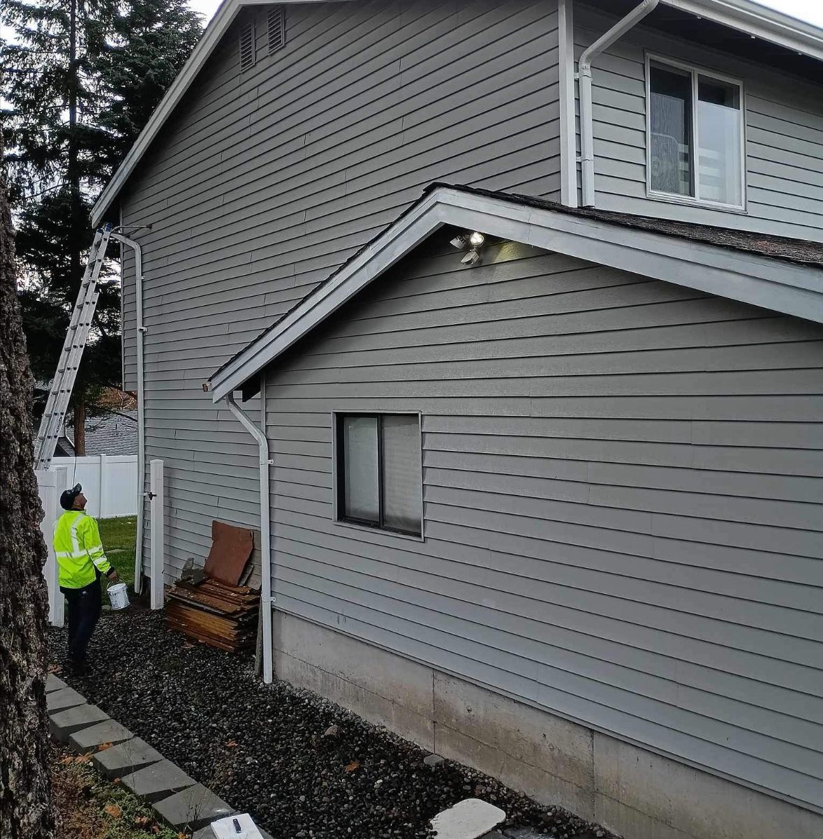Worker Holding Paint Can — Lacey, WA — Seamless Gutters Troy Services LLC