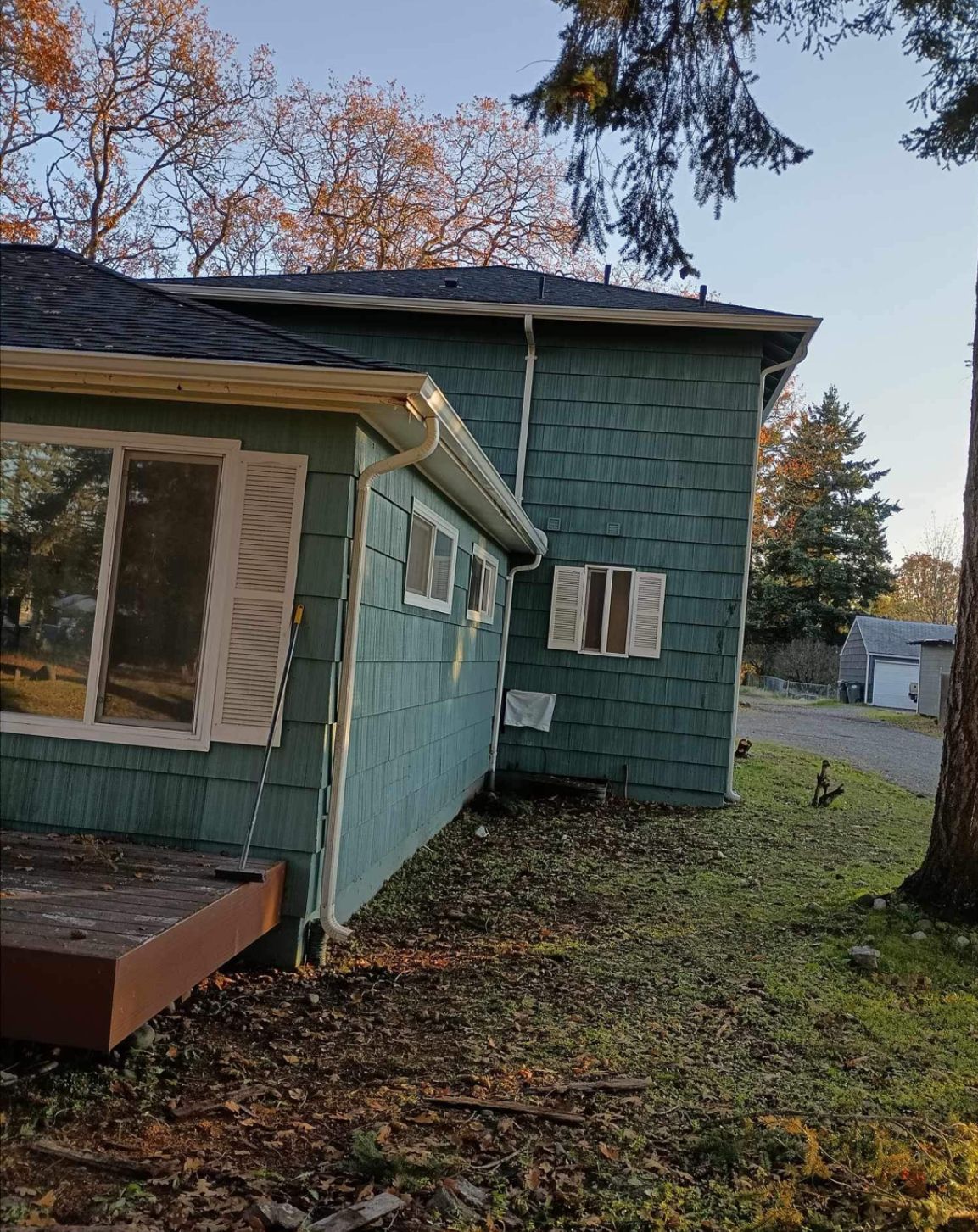 Teal House With Newly Installed Gutter — Lacey, WA — Seamless Gutters Troy Services LLC