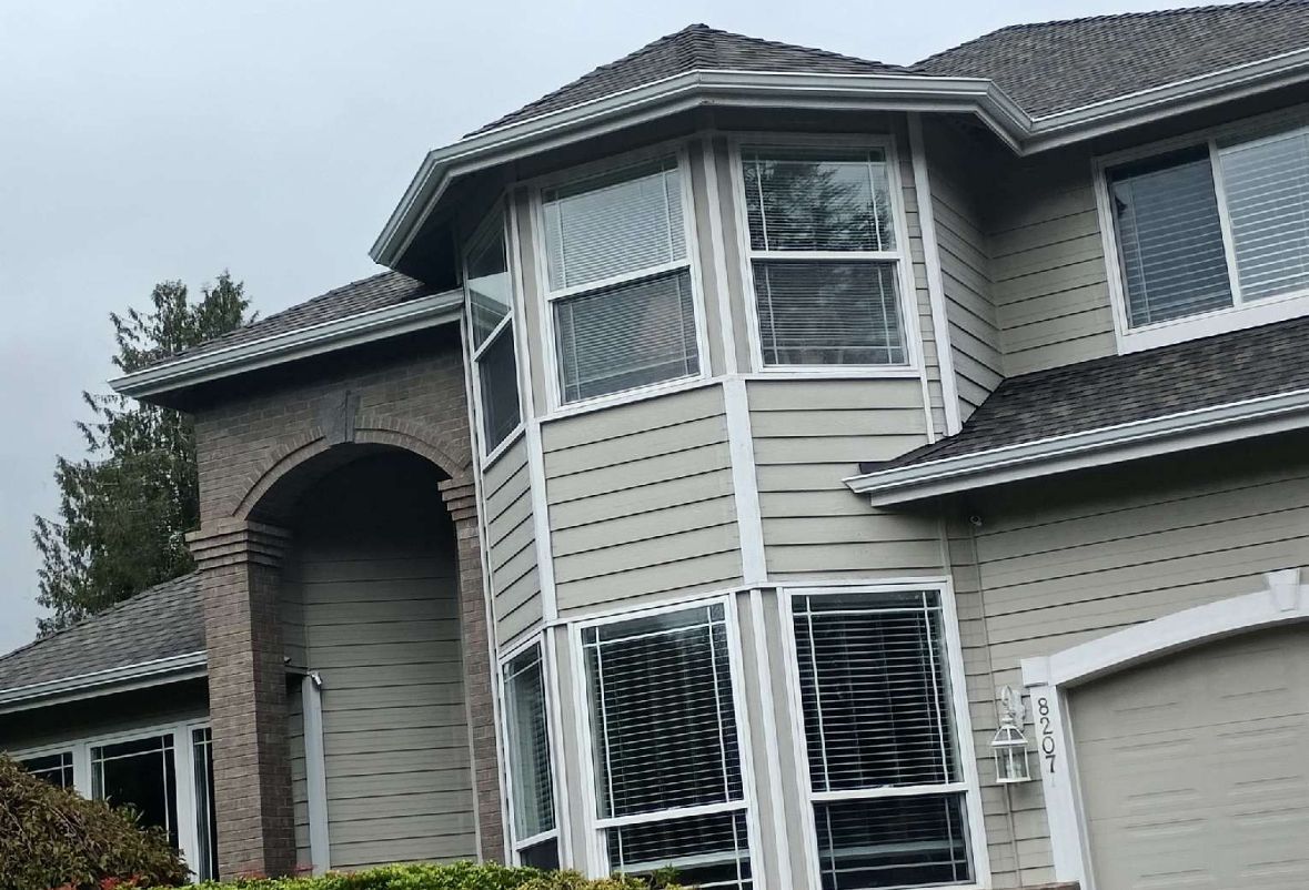 Peach Colored House with Brown Roof — Lacey, WA — Seamless Gutters Troy Services LLC
