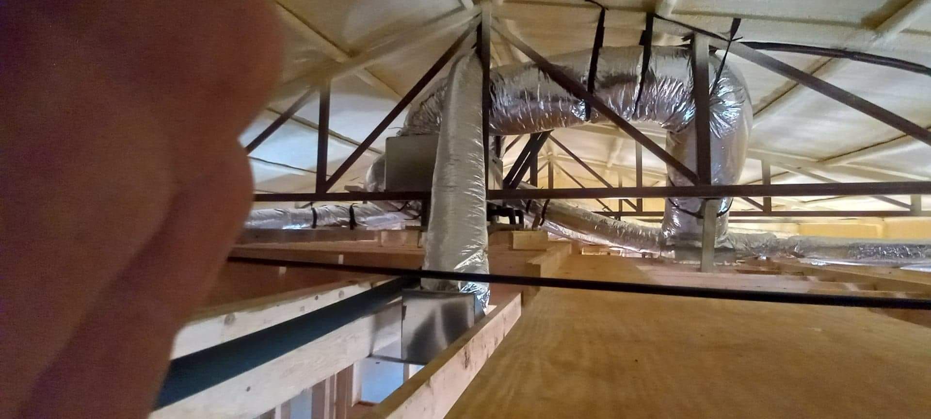 A person is looking up at the ceiling of a building.