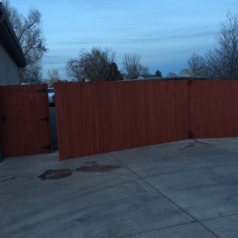 Red Painted Fence — Painting in Commerce City, CO