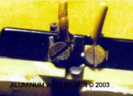 A close up of an aluminum wire repair tool