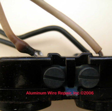 A close up of a aluminum wire repair inc 2006