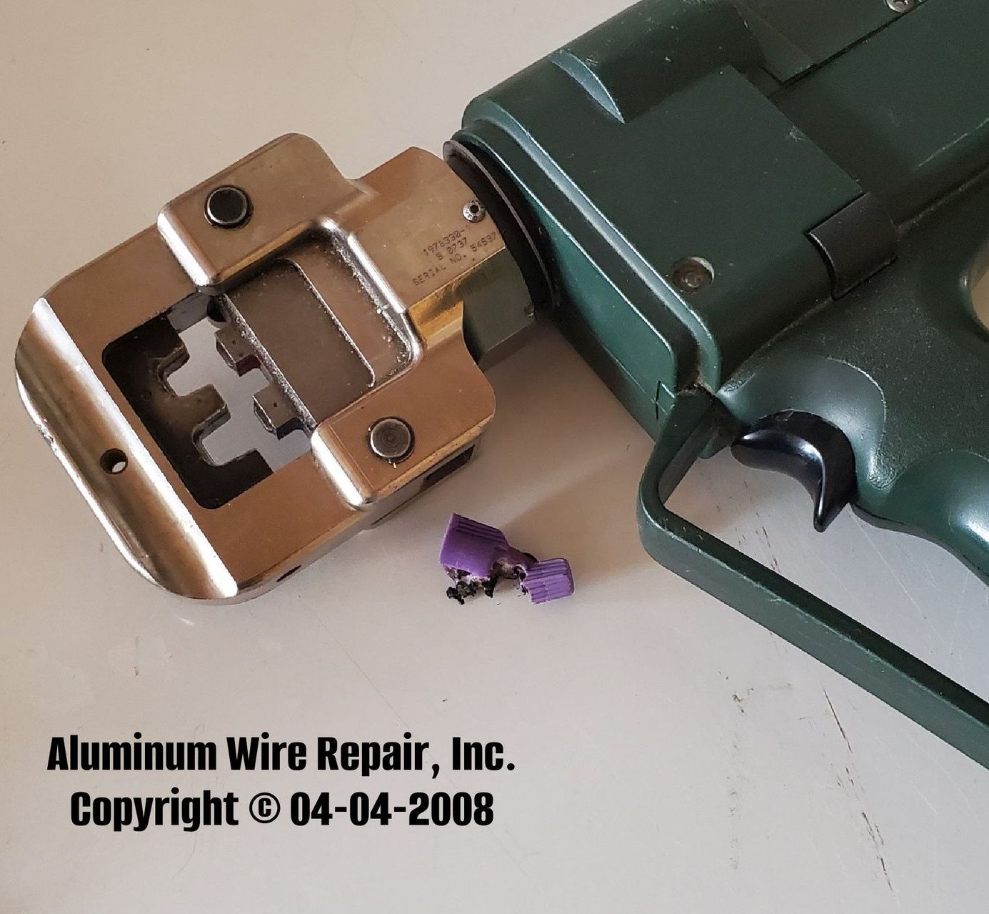 A bunch of wires are coming out of a hole in the ceiling.