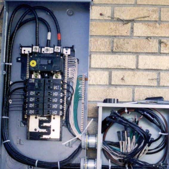 An electrical box with the letter t on it