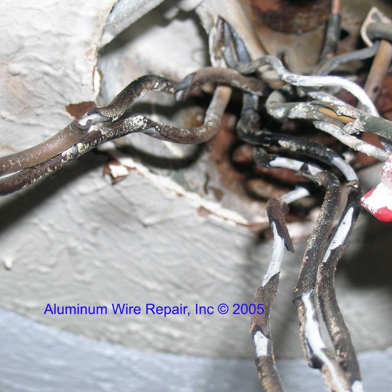 A close up of aluminum wire repair inc 2005