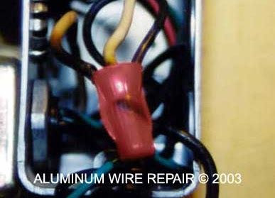 A close up of a aluminum wire repair in 2003