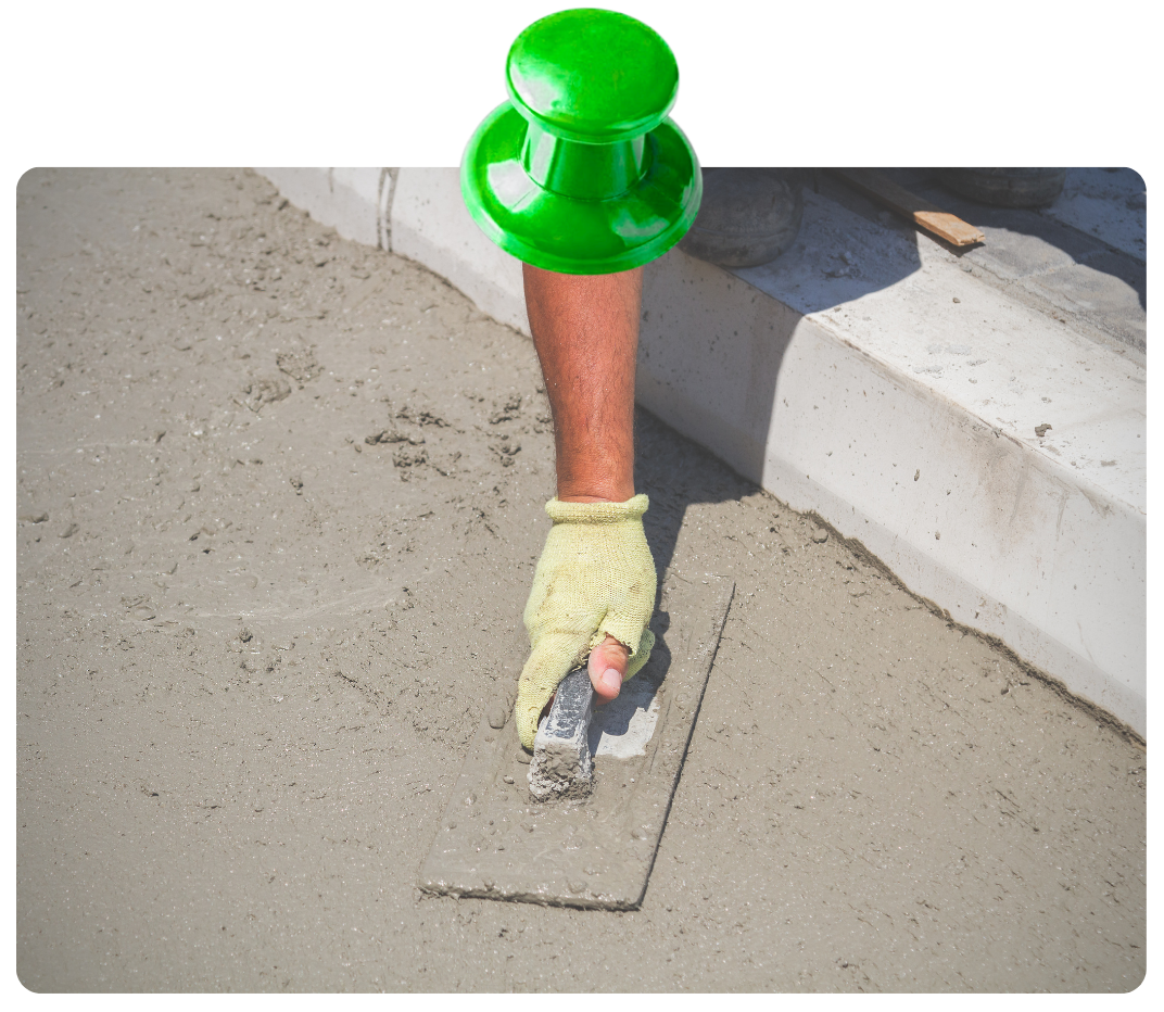 Concrete retaining wall installation protecting sloped backyard from erosion