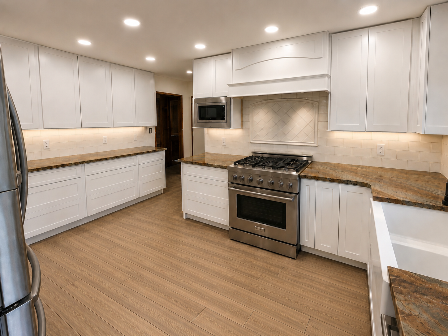 Bright modern kitchen with white cabinets, wood countertops, and stainless steel stove under recessed lights