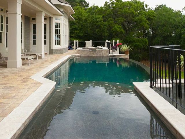 Relaxing View of a Pool Beside a House — Summerville, SC — Clearblue Pools