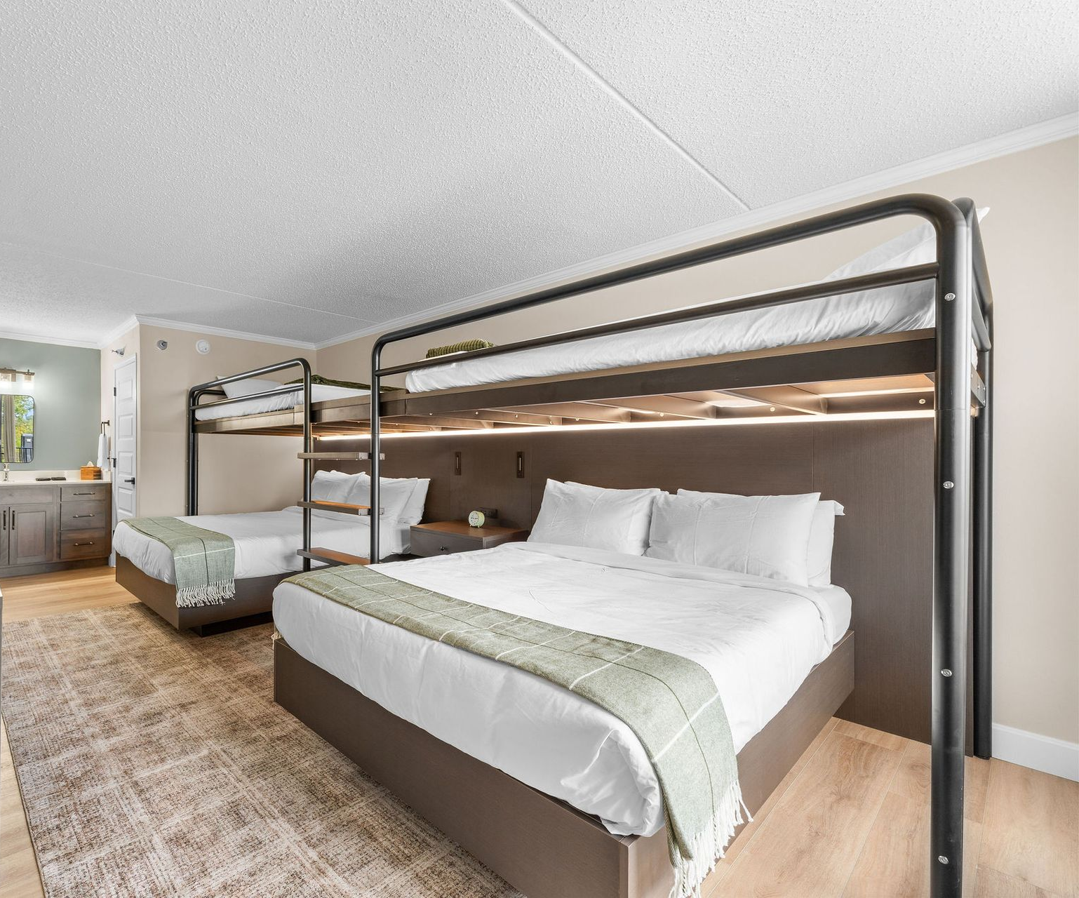 A large white building with a parking lot in front of it.