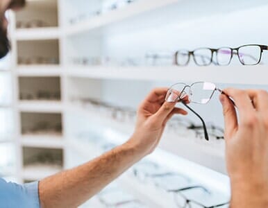 Designer Eyewear — Man Holding for the Eye Glasses in Colorado Springs, CO