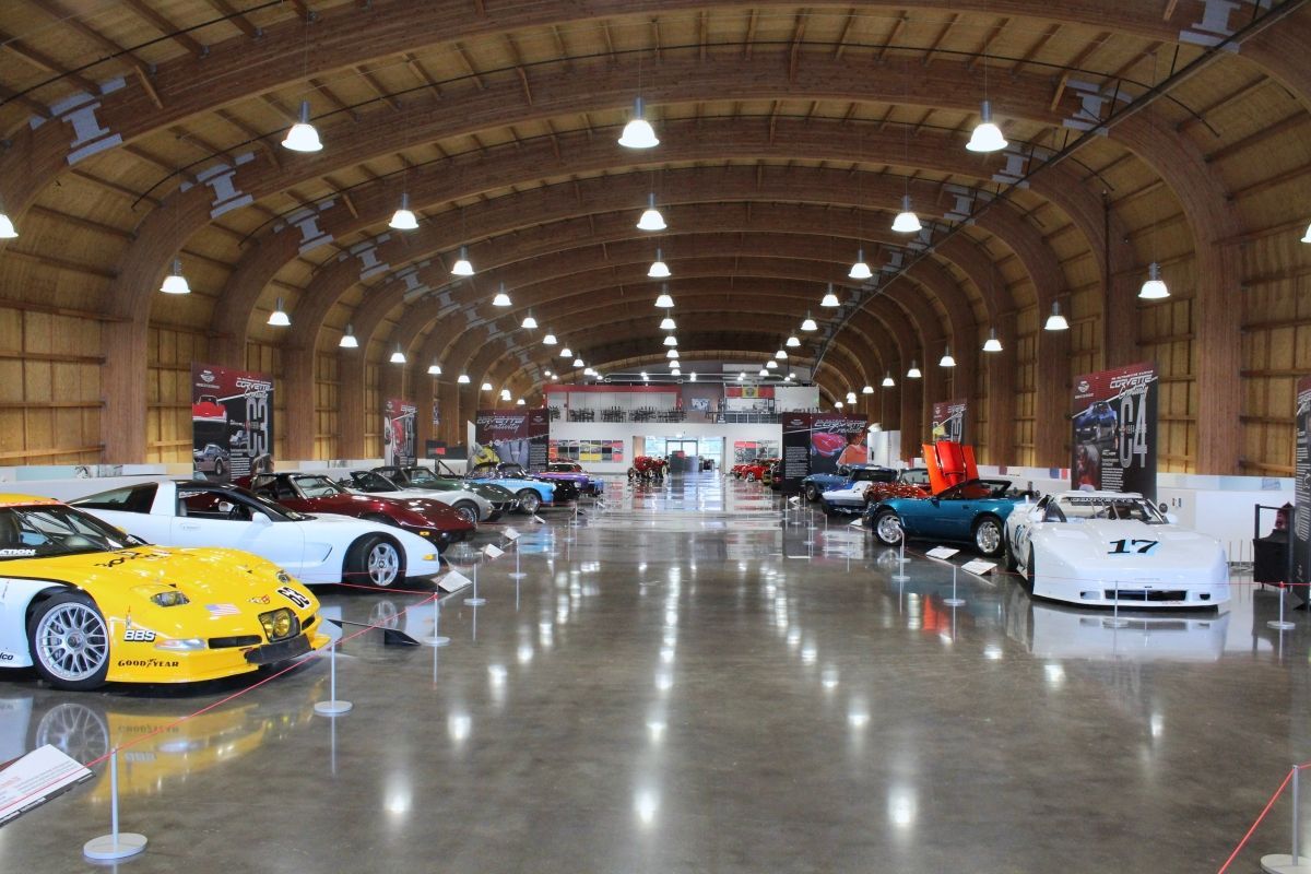 A large building with a lot of cars in it