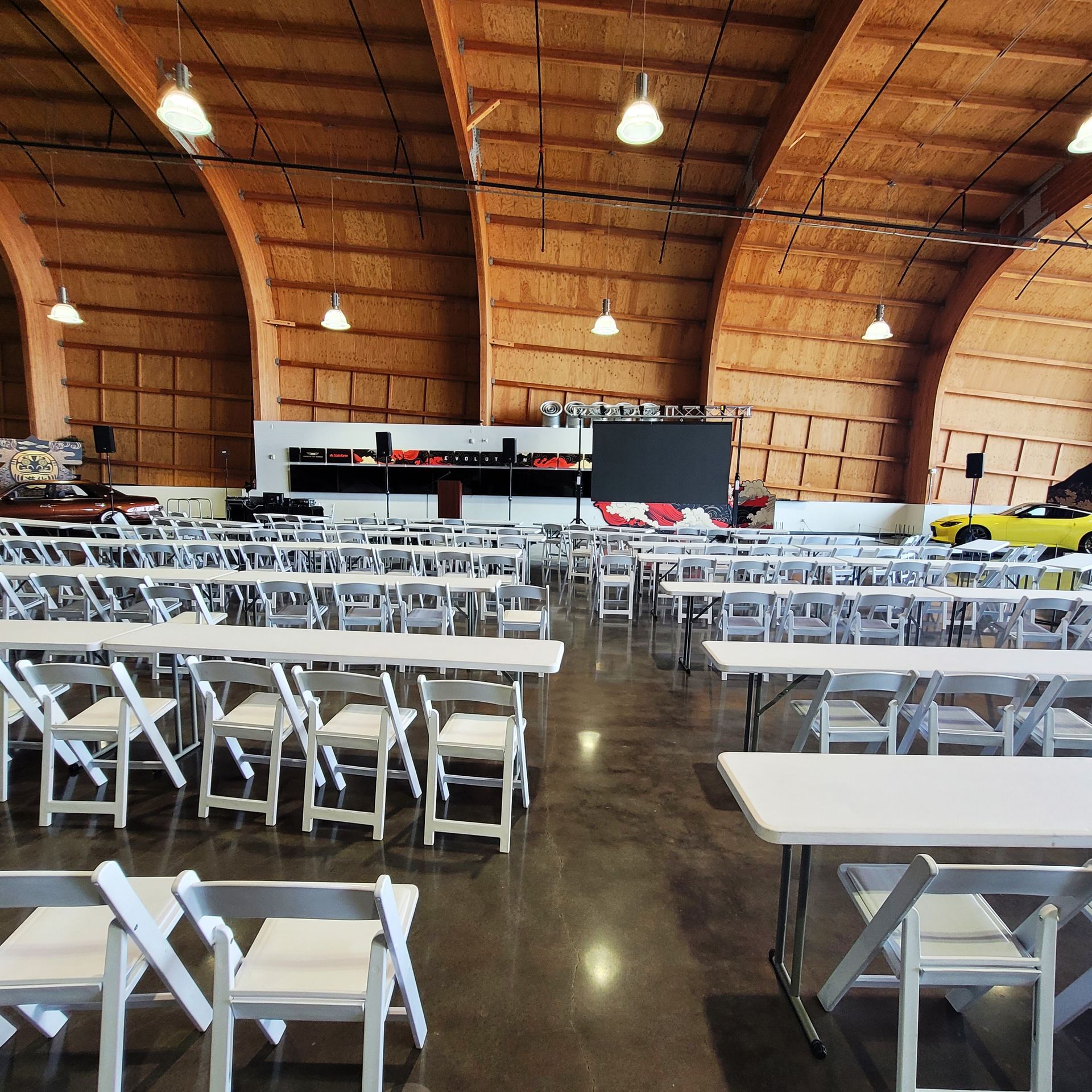 A large room with tables and chairs in it