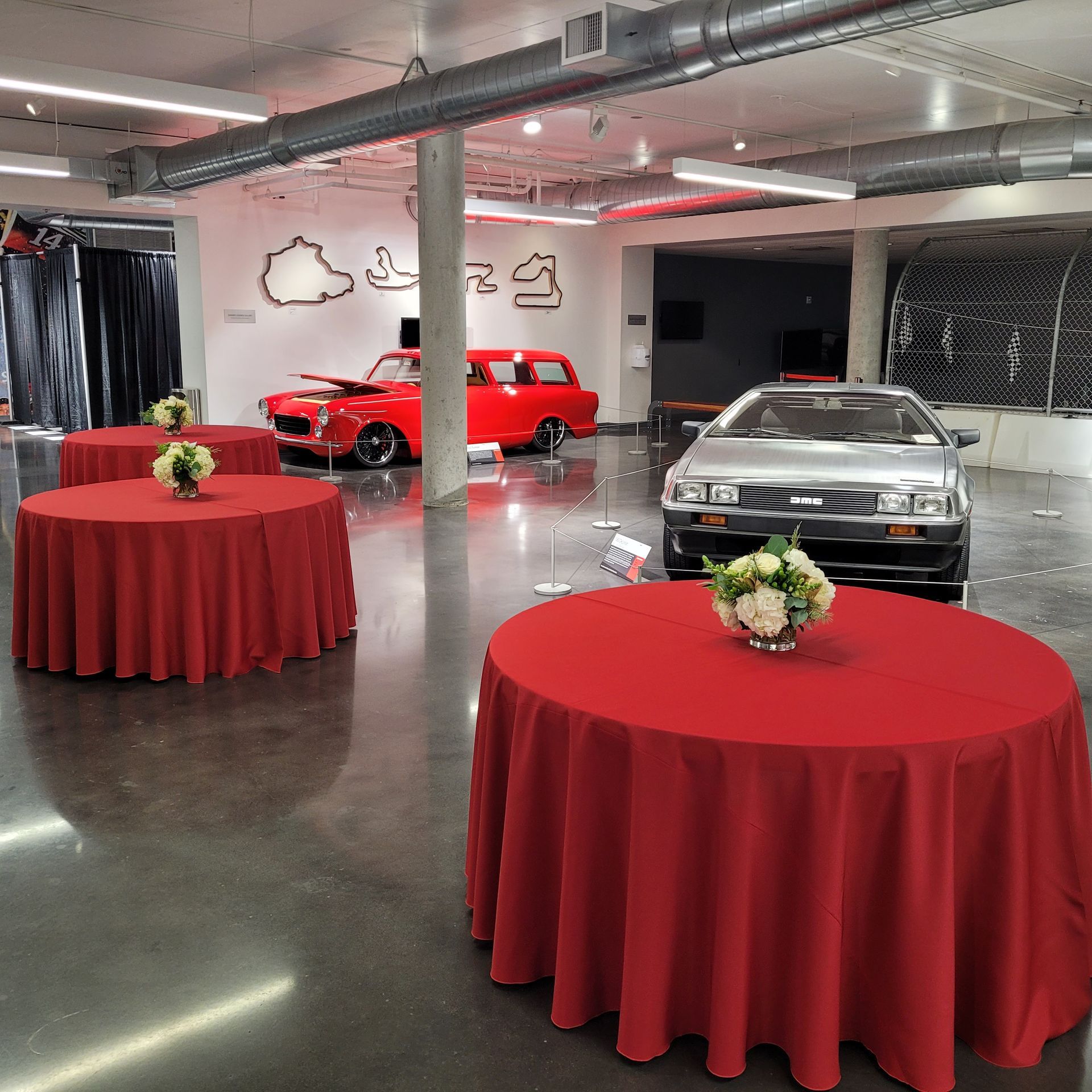 A red table cloth is on a round table