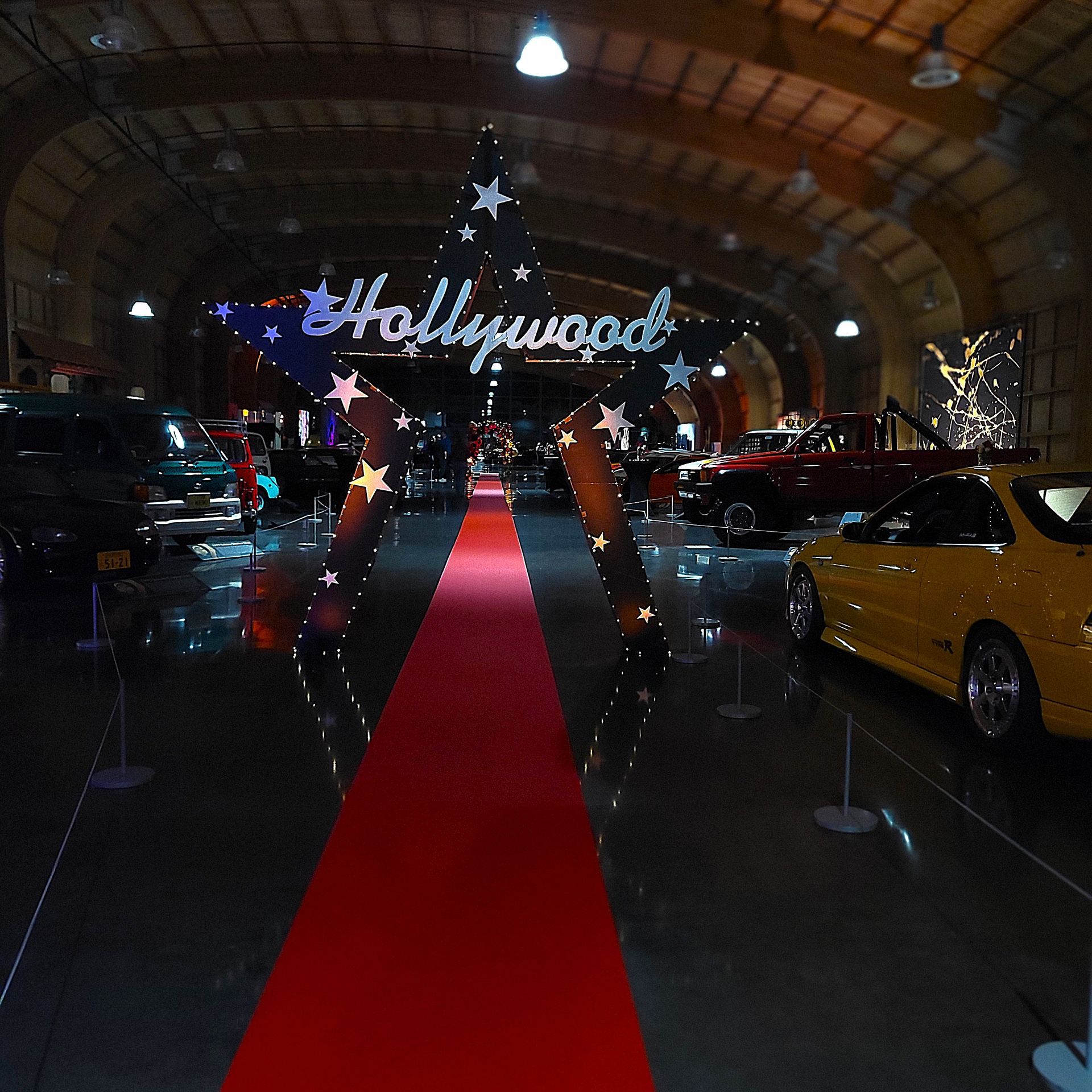 A red carpet leads to a sign that says hollywood