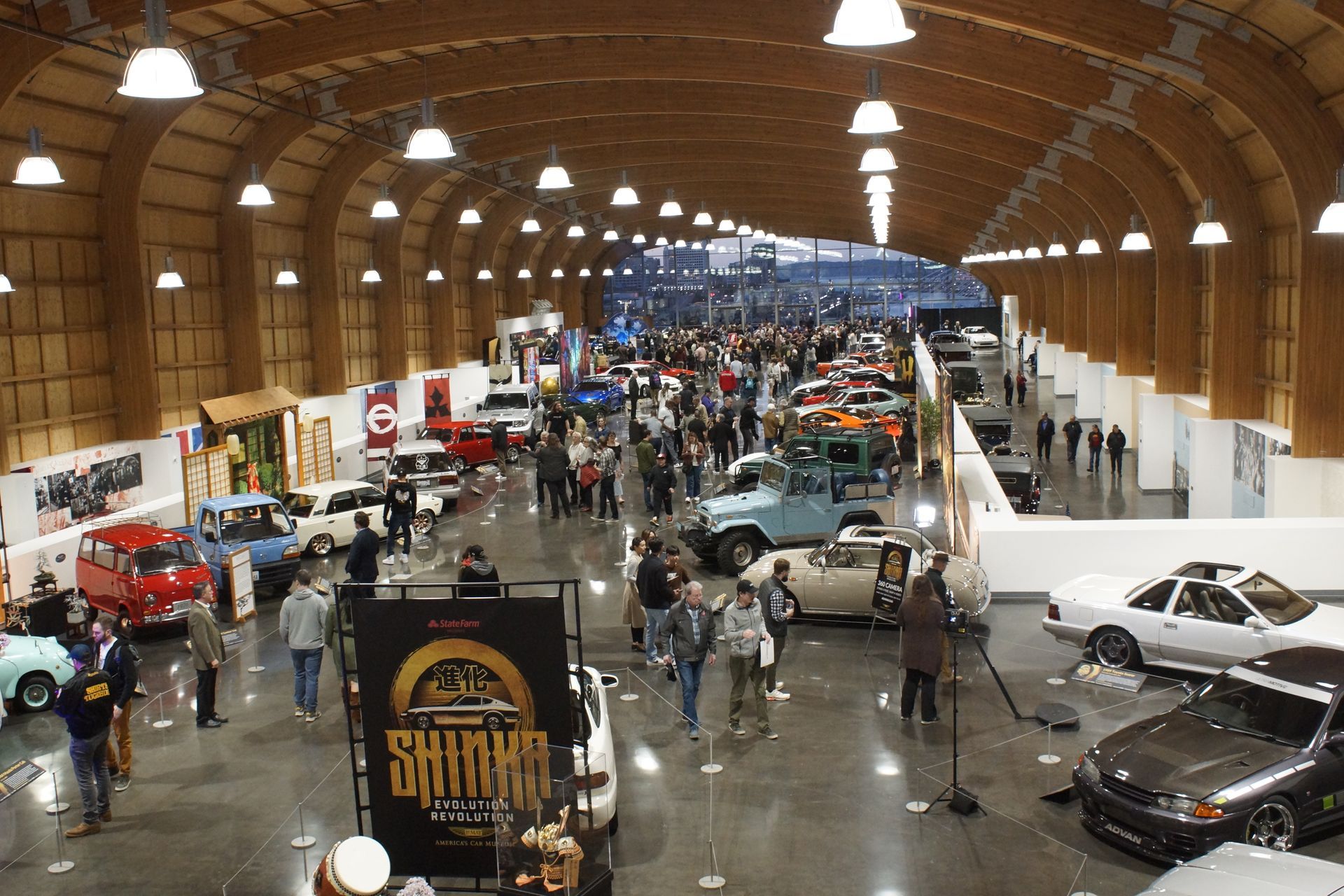 An aerial view of a car show with a sign that says ' samurai ' on it