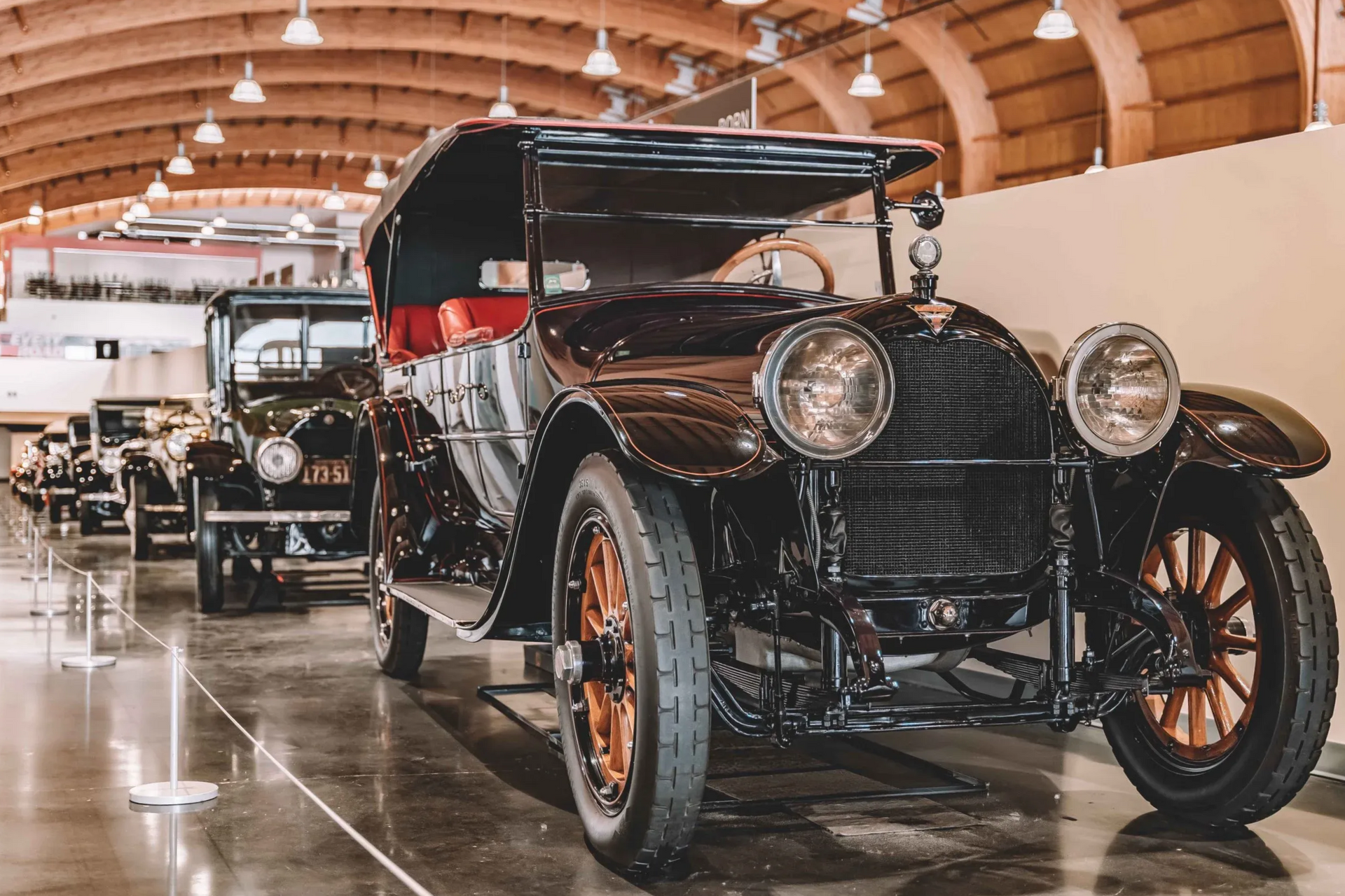 An old car is on display in a museum.