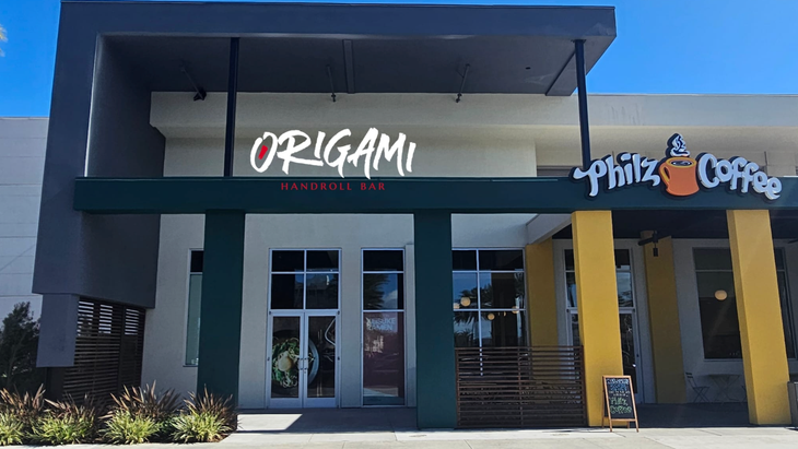 a building with a sign that says origami on it