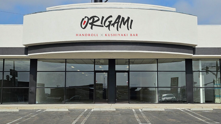 a building with a sign that says origami on it