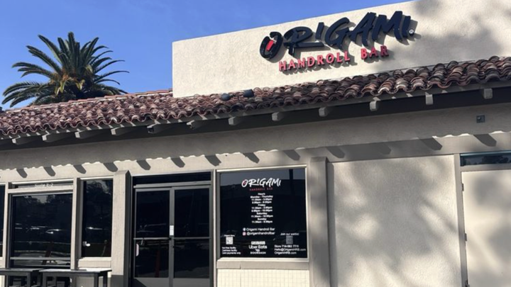 a building with a sign that says origami on it