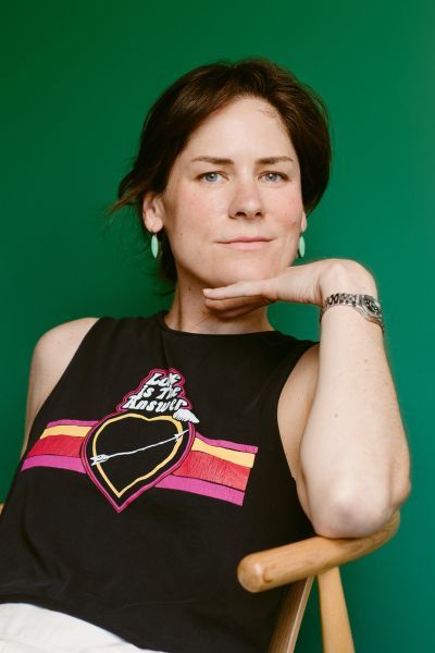 A professional headshot of author Hannah Pittard. She has shoulder-length brown hair and is looking at the camera with a soft, pleasant expression. She is wearing a dark top. The photo is taken from a medium-close range against a simple, neutral gray background.