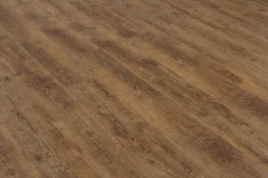 A close up of a wooden floor in a room.