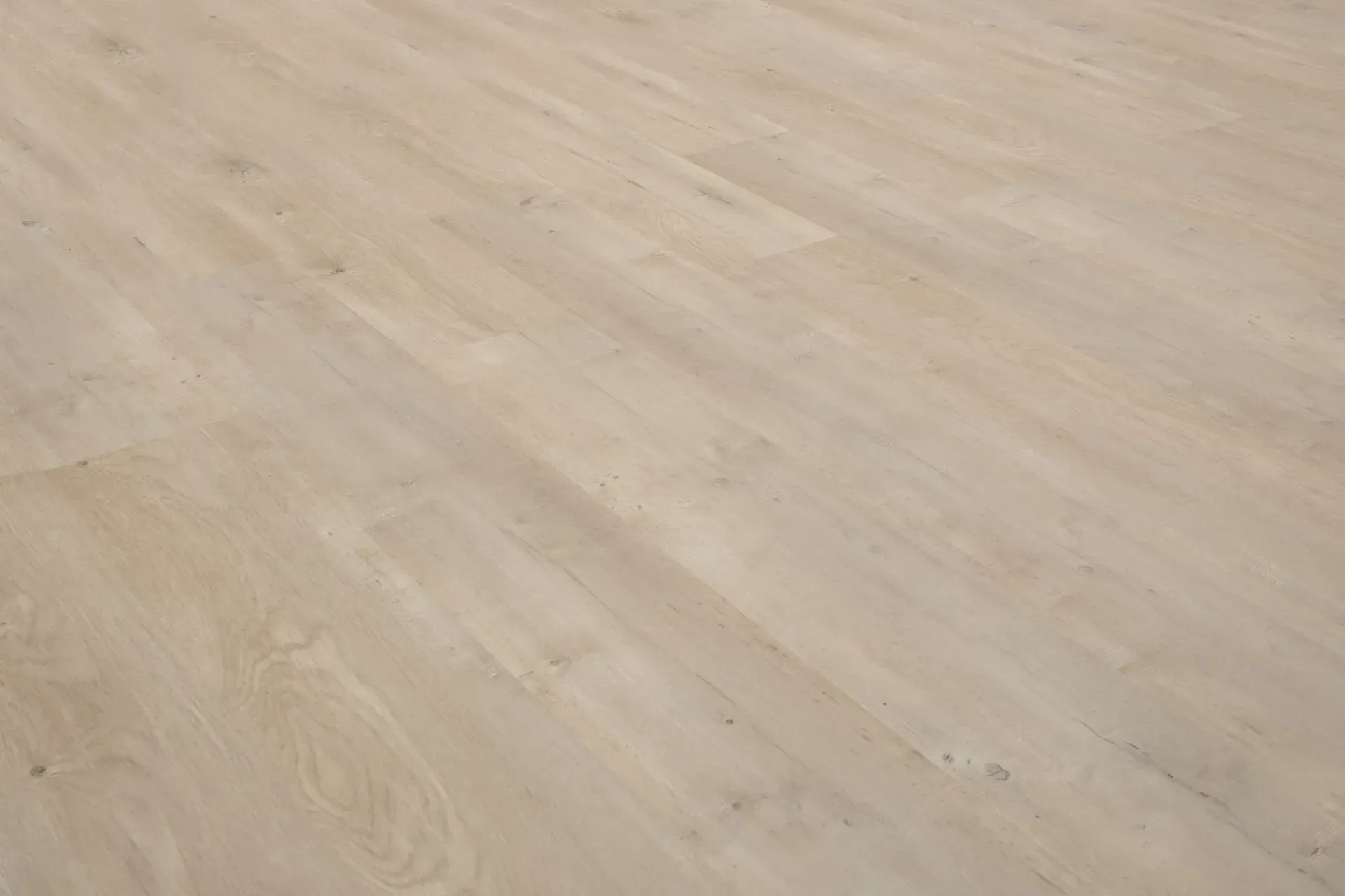 A close up of a wooden floor in a room.
