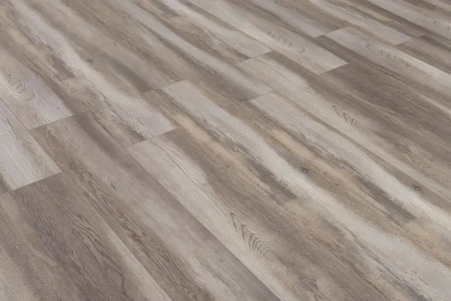 A close up of a wooden floor in a room.