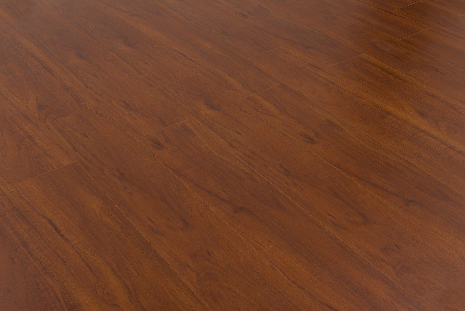 A close up of a wooden floor in a room.