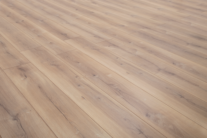 A close up of a wooden floor in a room.