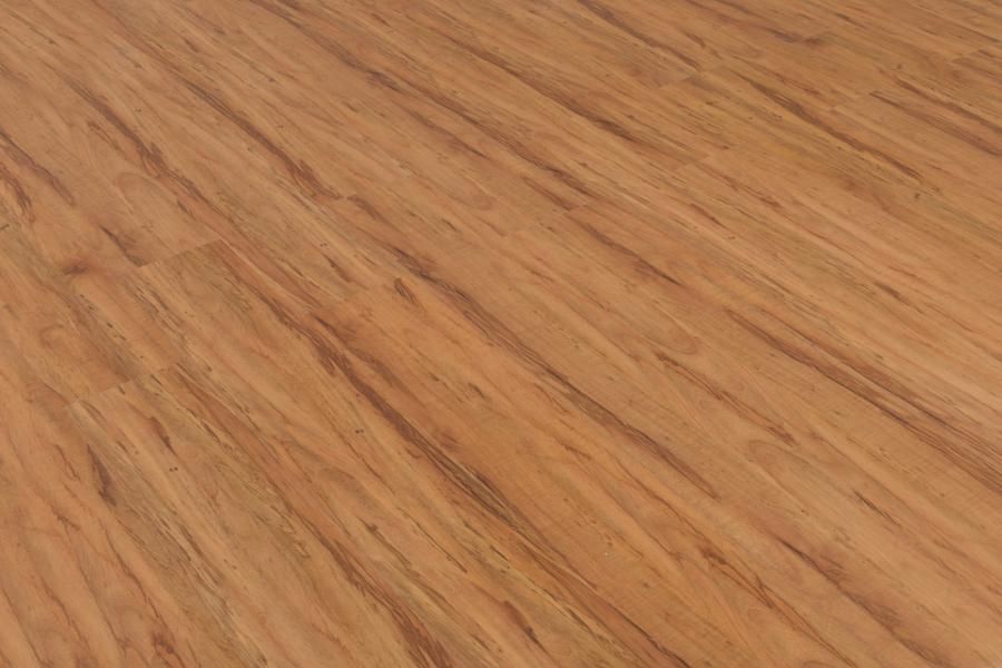 A close up of a wooden floor with a diagonal pattern.