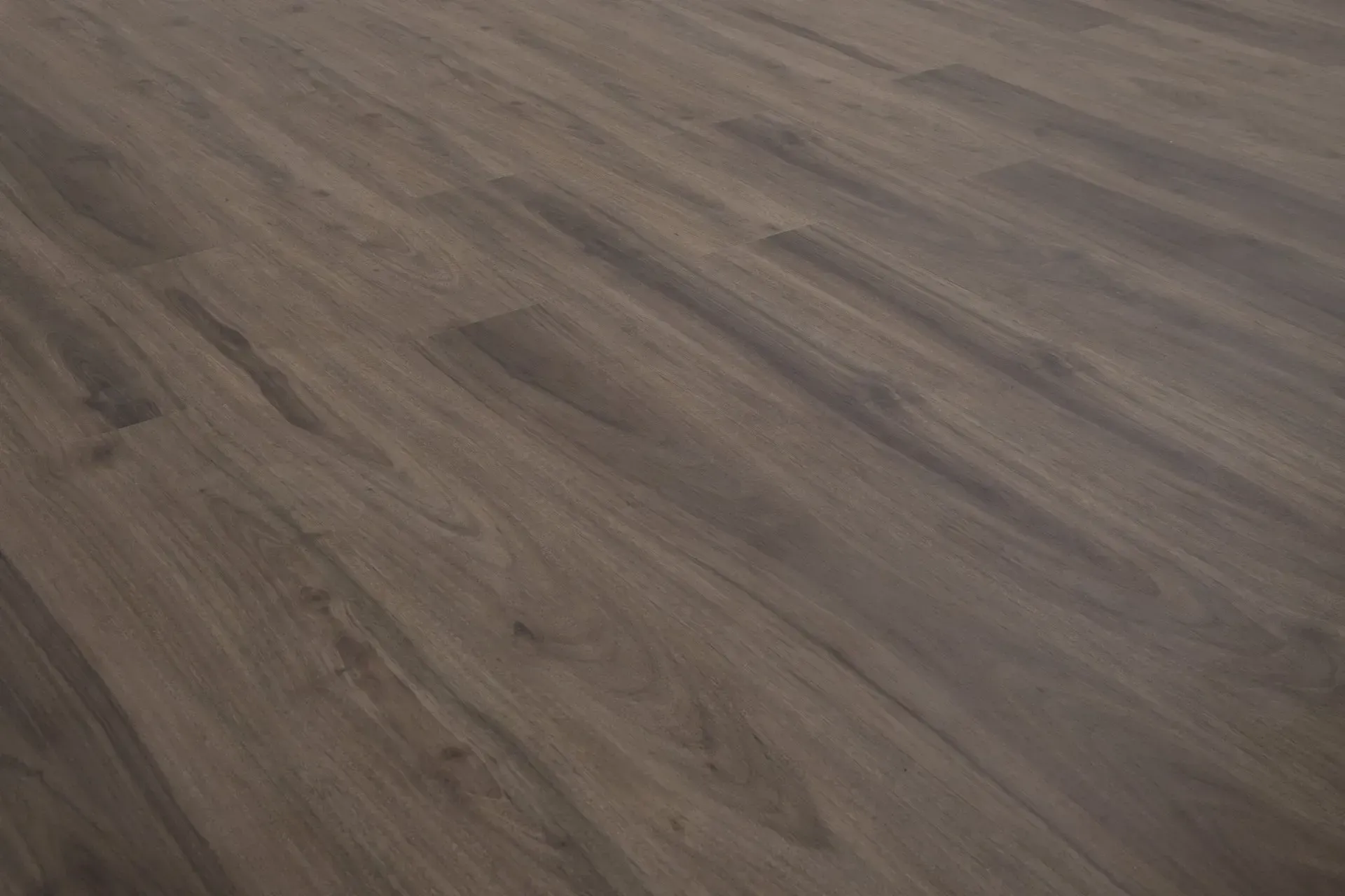 A close up of a wooden floor in a room.