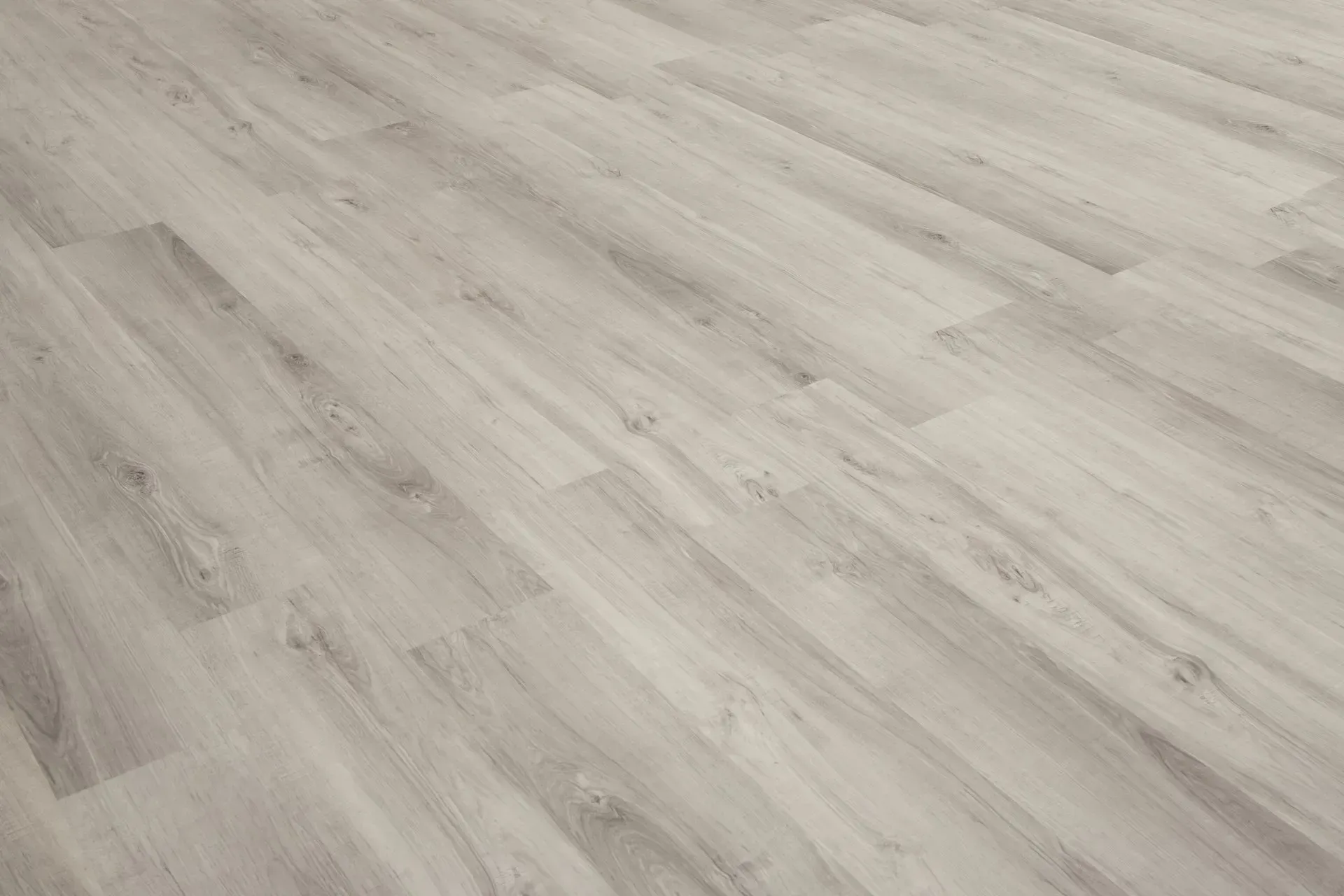 A close up of a white wooden floor in a room.