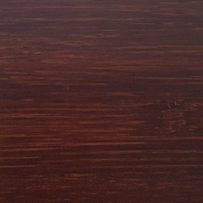 A close up of a piece of dark wood.