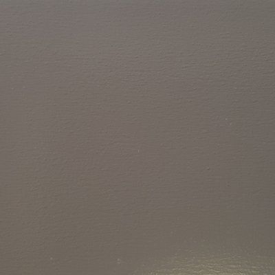 A close up of a gray tile with a shiny finish.