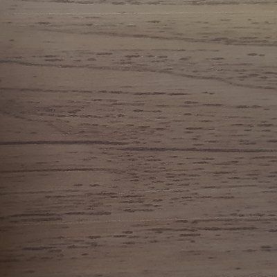 A close up of a piece of wood showing the grain and texture.