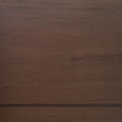 A close up of a piece of brown wood.