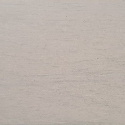 A close up of a white surface with a grainy texture.