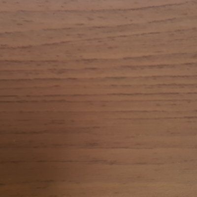 A close up of a piece of wood showing the grain and texture.