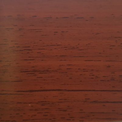 A close up of a piece of wood showing the grain and texture.