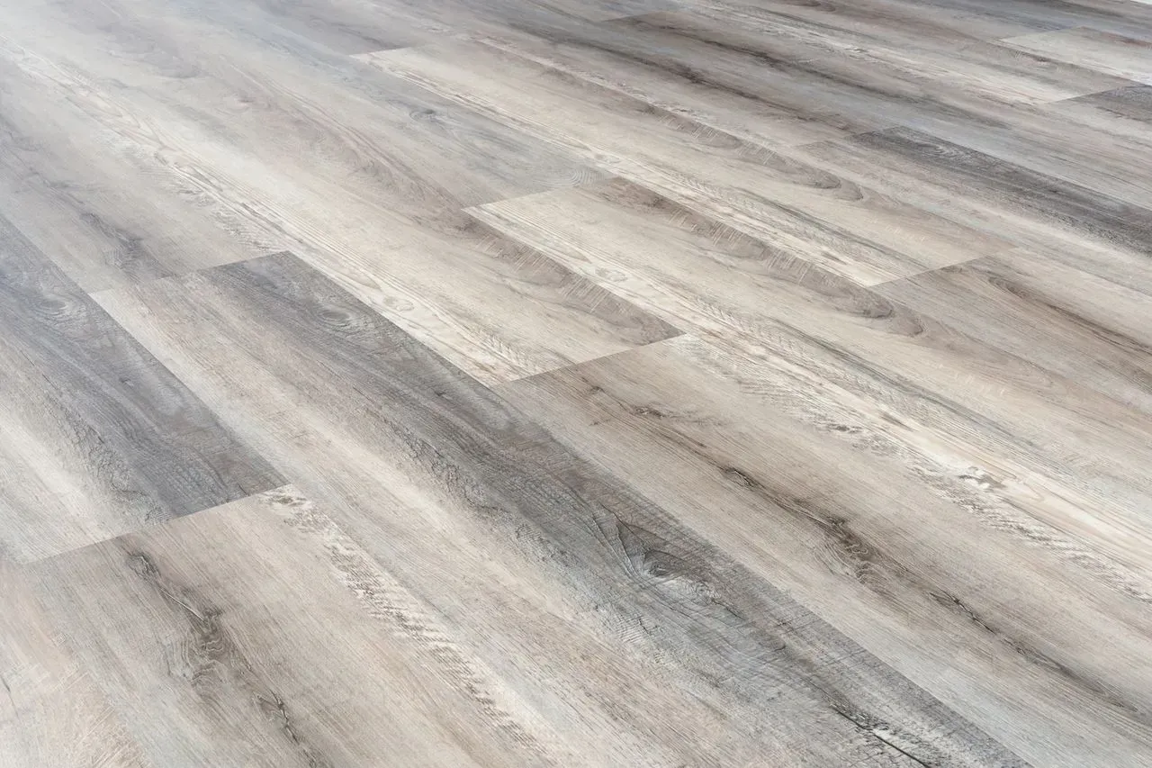 A close up of a wooden floor in a room.