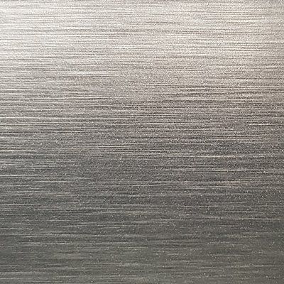 A close up of a stainless steel surface with a brushed finish.