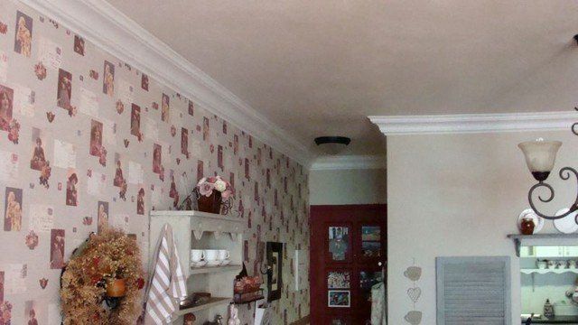 A living room with a wreath hanging on the wall