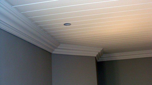 A room with a white ceiling and gray walls.