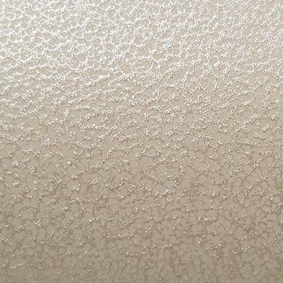 A close up of a white surface with a texture.