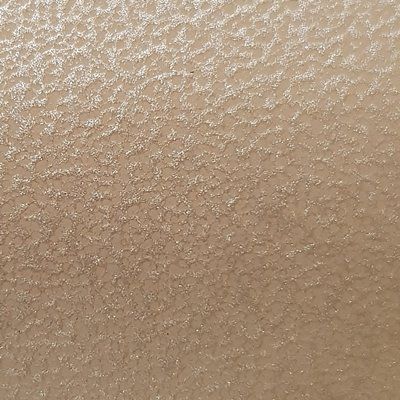 A close up of a brown surface with a grainy texture